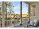 Charming porch offers scenic views with cozy wicker seating at 26 Saturday Rd, Mount Pleasant, SC 29464