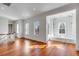Spacious second floor landing with window seating, built-in shelves, and hardwood floors at 26 Saturday Rd, Mount Pleasant, SC 29464