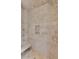 Walk-in shower with tan stone tiles, a built-in seat, and a niche for toiletries at 26 Saturday Rd, Mount Pleasant, SC 29464