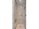 Luxurious marble shower featuring a shower bench and custom mosaic tile flooring at 26 Saturday Rd, Mount Pleasant, SC 29464