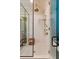 Modern bathroom featuring subway tiles, mosaic floors, and a glass-enclosed shower with a bronze shower head at 29 Broad St # A C, Charleston, SC 29401