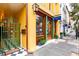 Charming building with a beautiful entrance, featuring a gate and signage for 