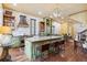 Gourmet kitchen featuring a large island with seating, stainless steel appliances, and plenty of storage at 29 Broad St # A C, Charleston, SC 29401