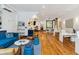 Spacious office featuring open layout with modern furniture, a lounge, and a kitchenette with blue accents at 29 Broad St # A C, Charleston, SC 29401