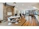 Modern office space featuring exposed brick, hardwood floors, and a conference table with stylish chairs at 29 Broad St # A C, Charleston, SC 29401