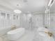 Luxury bathroom with soaking tub, glass-enclosed shower, and dual marble vanities at 309 N Civitas St, Mount Pleasant, SC 29464