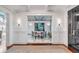 Elegant dining room with patterned tile flooring, white wainscoting, and a modern round table at 309 N Civitas St, Mount Pleasant, SC 29464