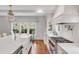 Gourmet kitchen with stainless appliances, large center island with white countertop and sink at 309 N Civitas St, Mount Pleasant, SC 29464