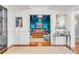 Elegant entry into a stylish living room featuring a large window, hardwood floors, and fine furnishings at 309 N Civitas St, Mount Pleasant, SC 29464