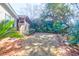 A verdant backyard featuring a lush lawn, mature trees, and privacy-enhancing shrubbery at 339 Cabell St, Charleston, SC 29407