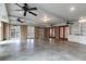 Large finished basement featuring sealed concrete floors, many ceiling fans, and multiple entry doors at 339 Cabell St, Charleston, SC 29407