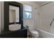 Functional bathroom featuring a unique ceramic sink, toilet, and a bathtub with shower and curtain at 339 Cabell St, Charleston, SC 29407