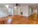 An airy bedroom with gleaming hardwood floors, a modern ceiling fan, and convenient access to an ensuite bathroom at 339 Cabell St, Charleston, SC 29407