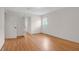 Bright bedroom with hardwood floors, a window, and a door, creates a versatile and welcoming atmosphere at 339 Cabell St, Charleston, SC 29407