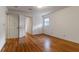 Light-filled bedroom with hardwood floors, neutral walls, and doorway access to the rest of the home at 339 Cabell St, Charleston, SC 29407