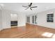 Bedroom features hardwood floors, ceiling fan, and entry to a bathroom, offers a seamless transition between spaces at 339 Cabell St, Charleston, SC 29407