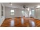 Bright bedroom with hardwood floors, a ceiling fan, and multiple windows with views of the outdoors at 339 Cabell St, Charleston, SC 29407