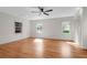 Bright and airy bedroom with hardwood floors and multiple windows offering ample natural light, creating a welcoming atmosphere at 339 Cabell St, Charleston, SC 29407