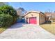 Exterior view of a home with a red garage door and adjacent driveway at 339 Cabell St, Charleston, SC 29407