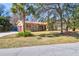 Lovely home featuring a red tile roof, well-kept lawn, and convenient garage access at 339 Cabell St, Charleston, SC 29407