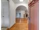 Inviting foyer with hardwood floors and arched doorway leading to a cozy living space at 339 Cabell St, Charleston, SC 29407