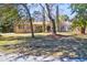 Charming home with a red tile roof, a well manicured lawn, and mature trees at 339 Cabell St, Charleston, SC 29407