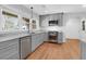 Modern kitchen features sleek gray cabinets, marble countertops, and stainless steel appliances at 339 Cabell St, Charleston, SC 29407