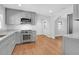 Bright kitchen with stainless steel appliances, stylish gray cabinetry and hardwood floors at 339 Cabell St, Charleston, SC 29407