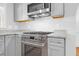 Modern kitchen featuring stainless steel appliances, gray cabinets, and granite countertops at 339 Cabell St, Charleston, SC 29407