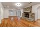 Living room featuring hardwood floors, fireplace, archways, and open floorplan at 339 Cabell St, Charleston, SC 29407