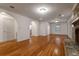 Bright living room with hardwood floors, fireplace, and architectural archways at 339 Cabell St, Charleston, SC 29407
