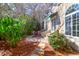 Inviting outdoor patio with stone walkway, lush greenery, and a charming covered area at 339 Cabell St, Charleston, SC 29407