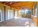 Spacious screened porch with wood flooring and ceiling fans, perfect for relaxing outdoors at 339 Cabell St, Charleston, SC 29407