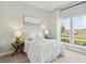 Comfortable bedroom with neutral tones, large windows, and stylish furnishings at 360 Citrus Dr, Summerville, SC 29486