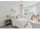 Bright bedroom featuring a cozy bed, stylish light fixture, and charming decor at 360 Citrus Dr, Summerville, SC 29486