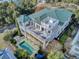 Aerial view of a stunning multilevel home with a distinctive green roof, multiple balconies, and a pool at 4000 Cameron Blvd, Isle of Palms, SC 29451