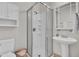 Cozy bathroom featuring a corner shower with glass door and pedestal sink at 4000 Cameron Blvd, Isle of Palms, SC 29451
