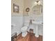 Elegant powder room showcasing hardwood floors and pedestal sink at 4000 Cameron Blvd, Isle of Palms, SC 29451