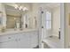 Bright bathroom featuring a white vanity, framed mirror, and glass-enclosed tiled shower at 4000 Cameron Blvd, Isle of Palms, SC 29451