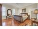 Spacious bedroom with hardwood floors, plantation shutters, and large windows at 4000 Cameron Blvd, Isle of Palms, SC 29451