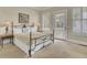 Comfortable bedroom featuring a queen bed with access to a private balcony at 4000 Cameron Blvd, Isle of Palms, SC 29451