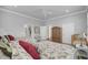 Bright bedroom showcasing two beds, white wicker chair, and neutral decor at 4000 Cameron Blvd, Isle of Palms, SC 29451