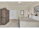 Cozy bedroom featuring a decorative bed frame, wood cabinet, and neutral carpeting at 4000 Cameron Blvd, Isle of Palms, SC 29451