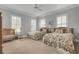 Bright, comfortable bedroom with two beds, and a ceiling fan at 4000 Cameron Blvd, Isle of Palms, SC 29451