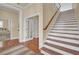 Entry way with wood stairs and floors and white trim throughout at 4000 Cameron Blvd, Isle of Palms, SC 29451