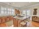 Spacious kitchen island featuring granite countertops, seating, and a gas cooktop at 4000 Cameron Blvd, Isle of Palms, SC 29451