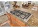 Close-up of the island gas cooktop, set in granite countertop at 4000 Cameron Blvd, Isle of Palms, SC 29451
