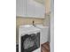 Laundry room with a modern washer and dryer and cabinets for storage at 4000 Cameron Blvd, Isle of Palms, SC 29451