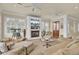 Living room with a fireplace, comfortable seating, and a telescope near the bright windows at 4000 Cameron Blvd, Isle of Palms, SC 29451