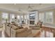 Spacious living room features a fireplace, large windows with natural light, and comfortable seating at 4000 Cameron Blvd, Isle of Palms, SC 29451